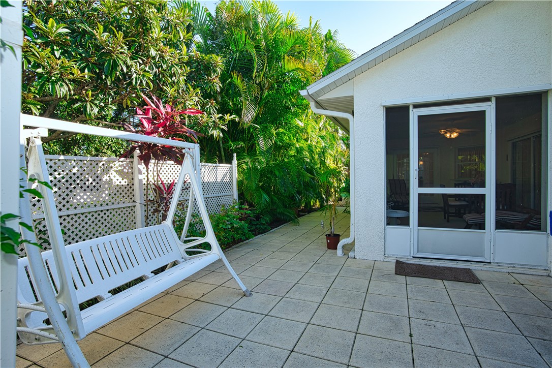 173 Easy Street Sebastian, FL 32958 - Photo 32 of 35 a view of a deck with chair and wooden fence