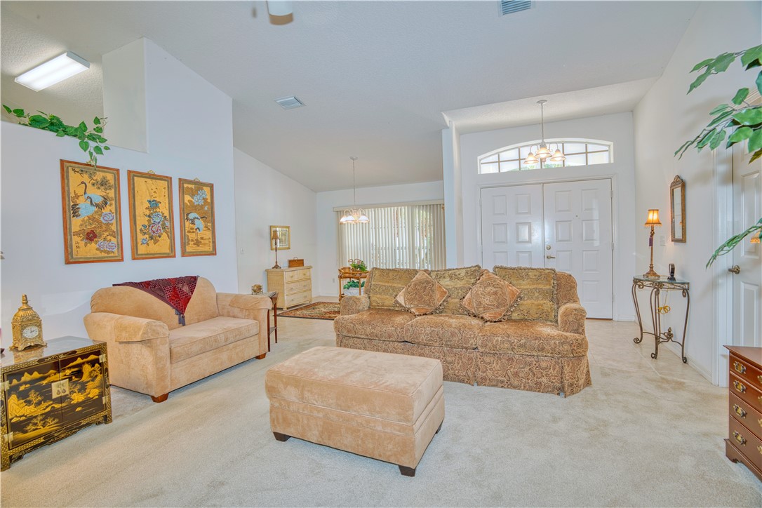 173 Easy Street Sebastian, FL 32958 - Photo 5 of 35 a living room with furniture and a window