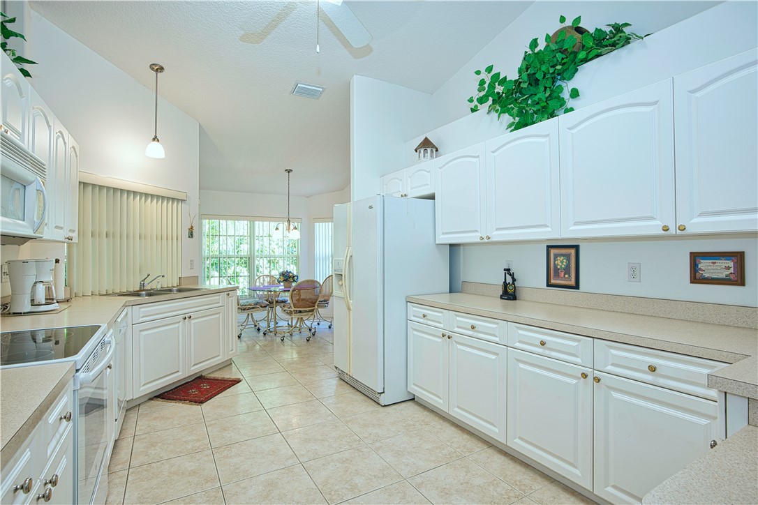 173 Easy Street Sebastian, FL 32958 - Photo 10 of 35 a kitchen with sink cabinets and window
