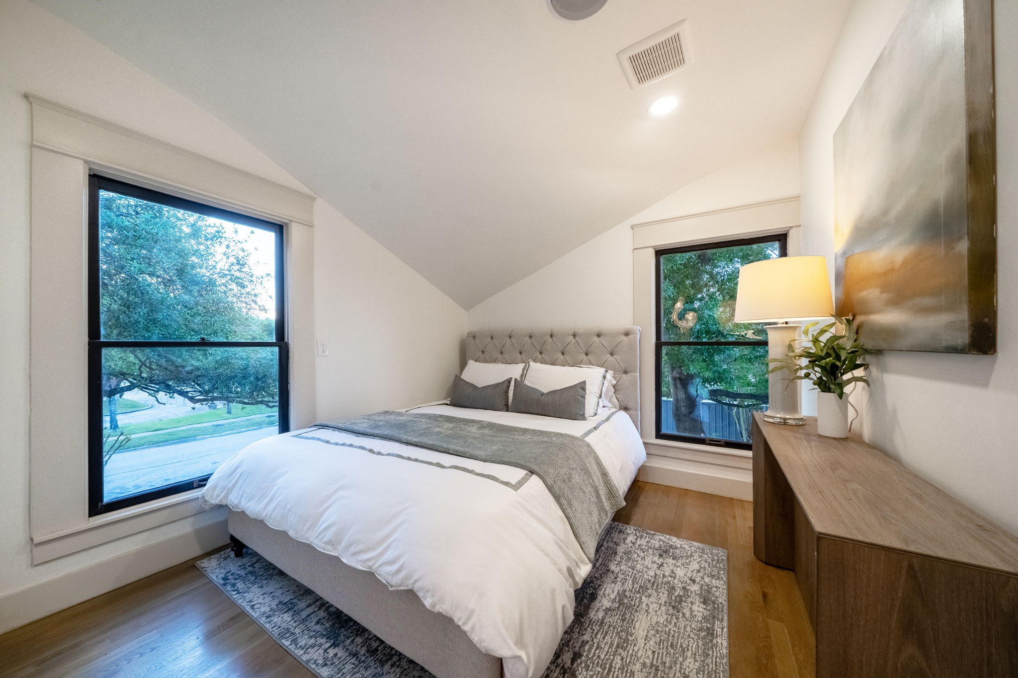 1109 Rutland Street Houston, TX 77008 - Photo 22 of 34 Once a utilitarian laundry room, this space has been thoughtfully transformed back into a cozy bedroom. With its charming view overlooking the front of the home, it’s the perfect spot to wake up to sunlight streaming through the windows or to enjoy a peaceful retreat at the end of the day.