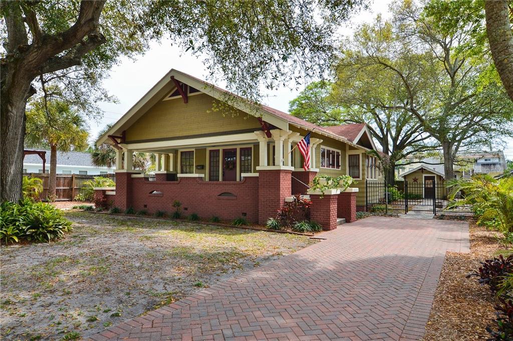 Beautifully restored cedar shake exterior with red brick bungalow located minutes from the beaches.