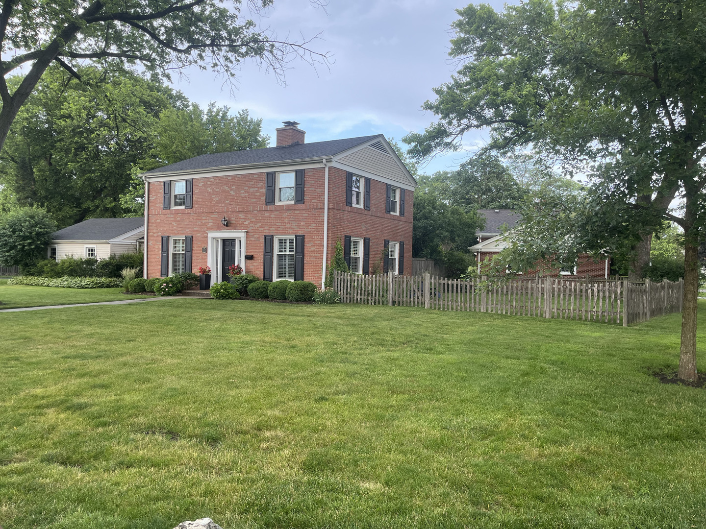 2430 Covert Road Glenview, IL 60025 - Photo 22 of 26 a front view of a house with a garden