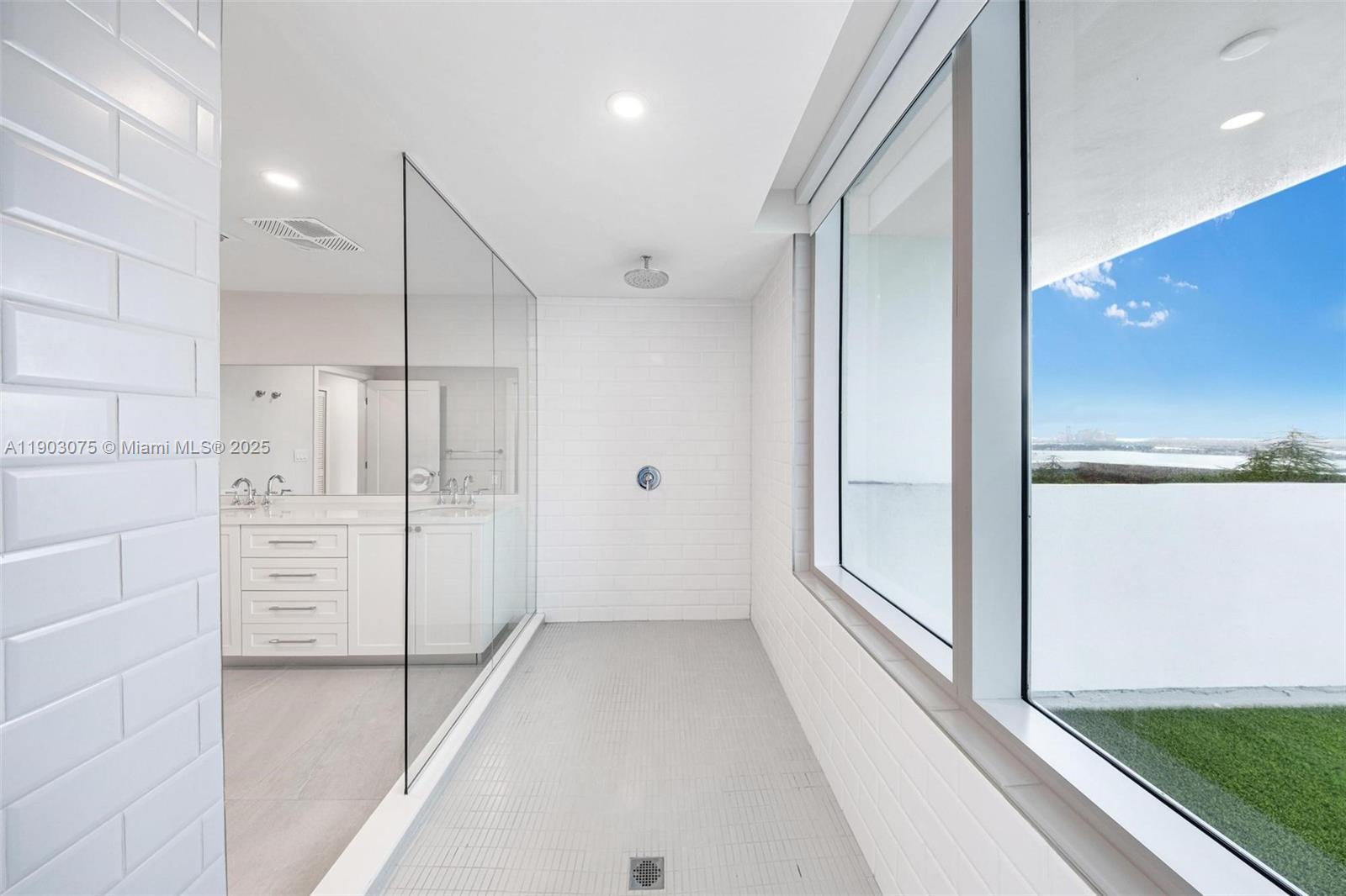 555 Northeast 34th Street, Unit PH3 Miami, FL 33137 - Photo 23 of 51 a bathroom with a shower and a tub