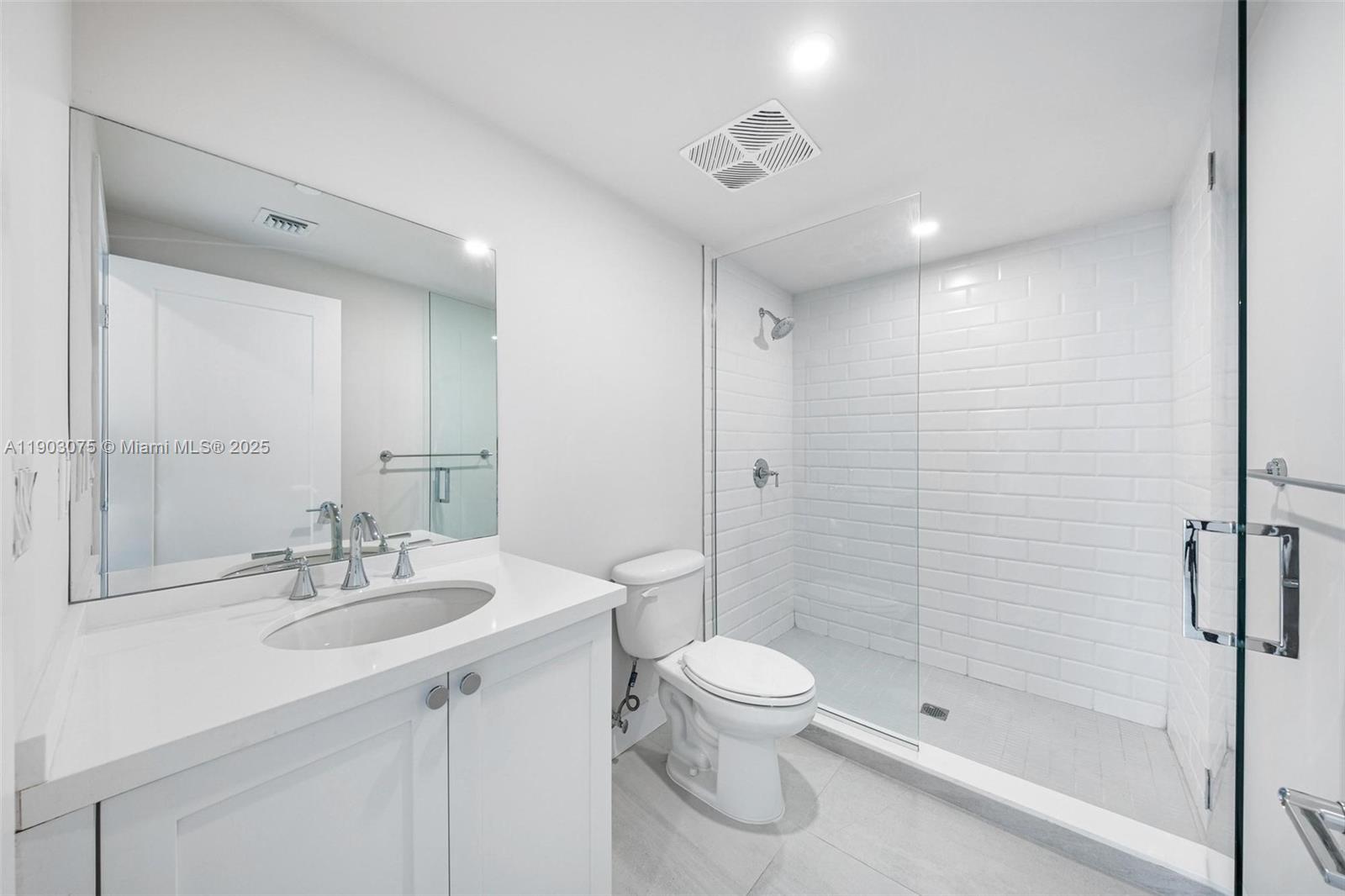 555 Northeast 34th Street, Unit PH3 Miami, FL 33137 - Photo 28 of 51 a bathroom with a sink toilet and shower