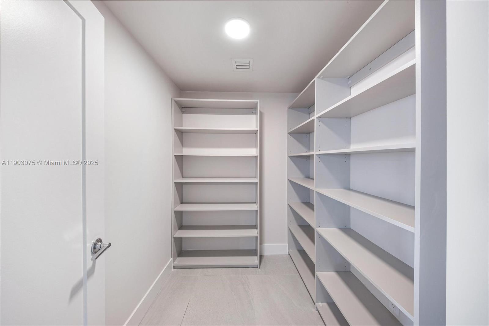 555 Northeast 34th Street, Unit PH3 Miami, FL 33137 - Photo 29 of 51 a view of walk in closet