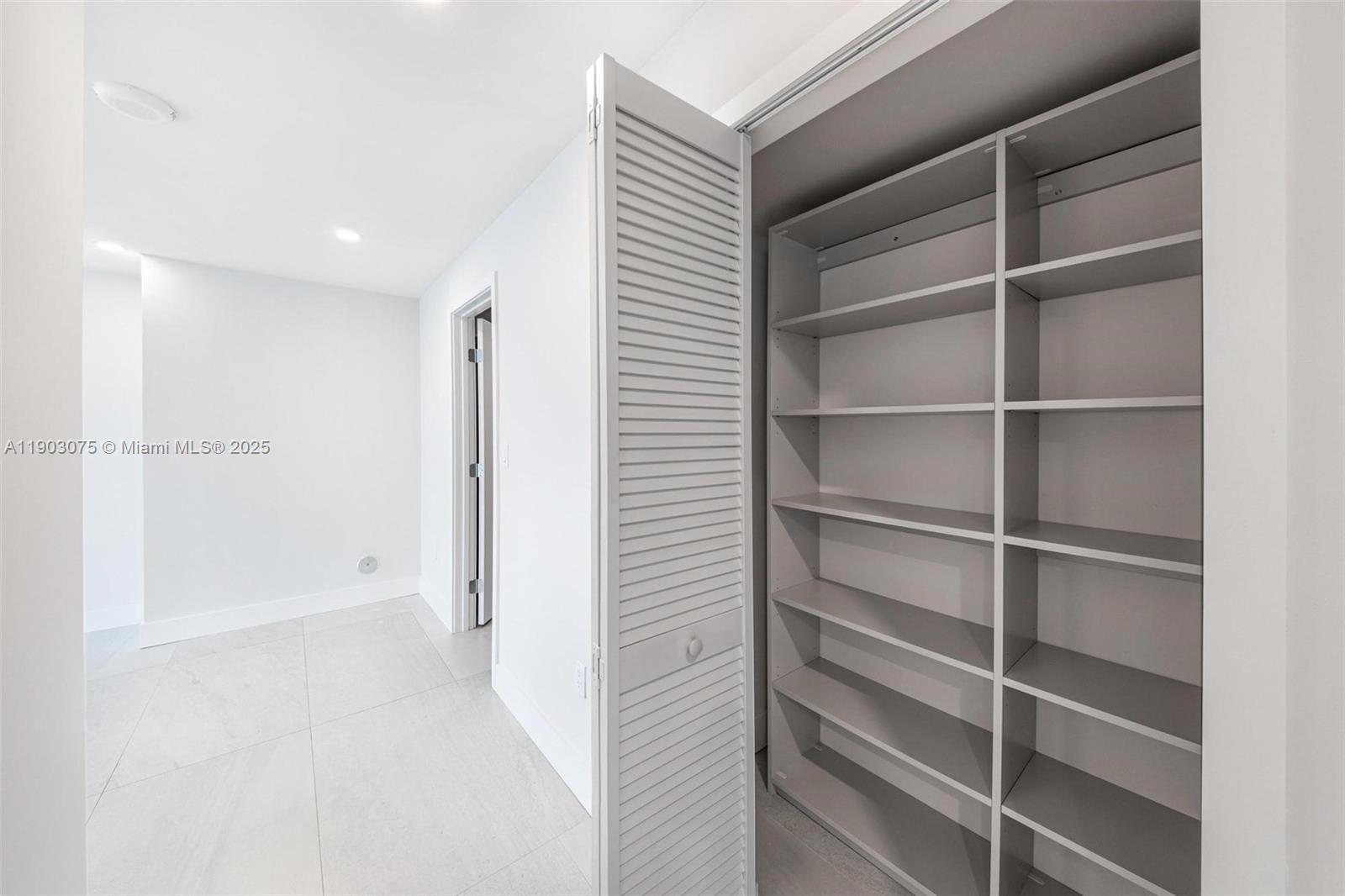 555 Northeast 34th Street, Unit PH3 Miami, FL 33137 - Photo 33 of 51 a view of a hallway with closet