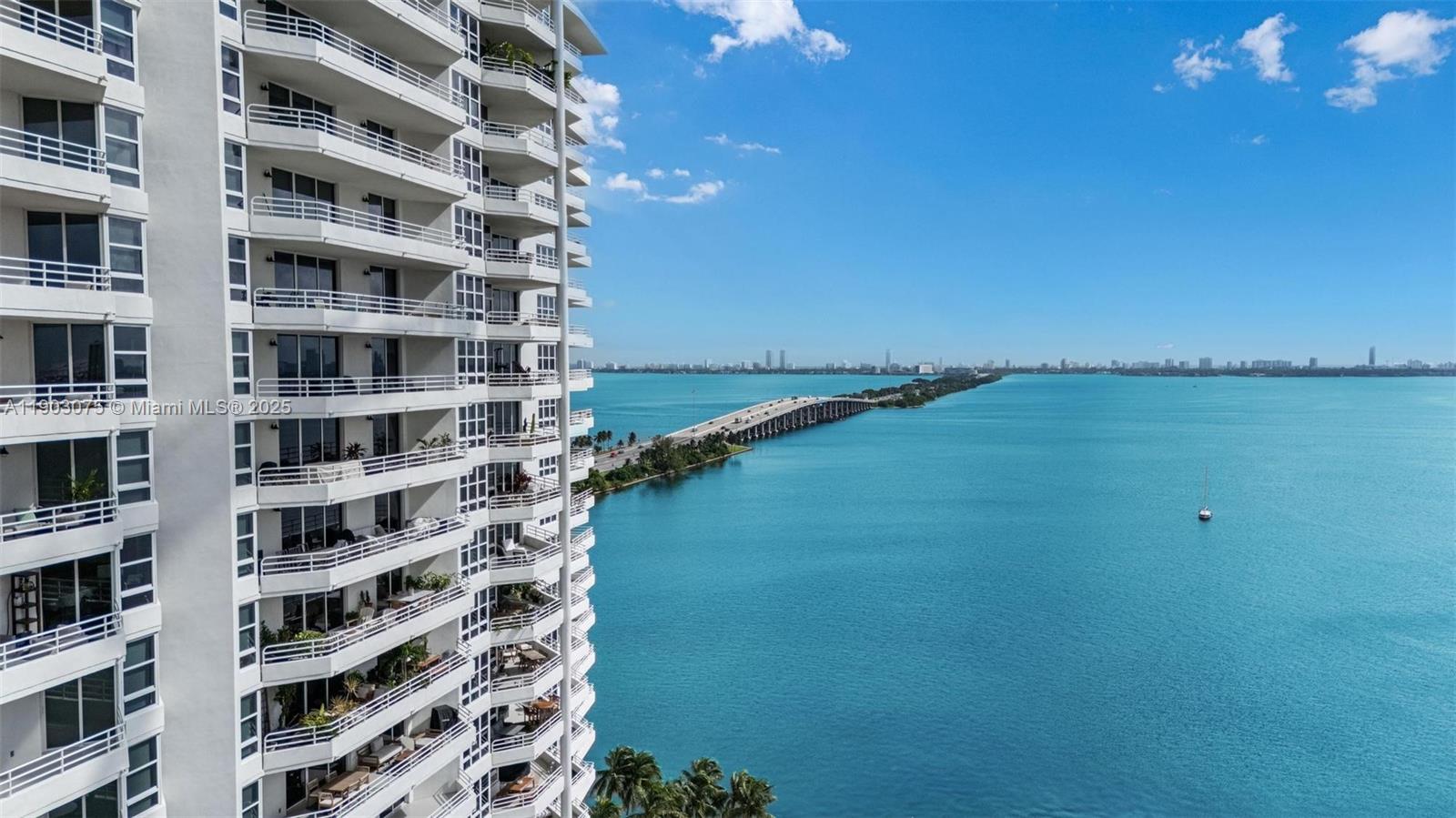 555 Northeast 34th Street, Unit PH3 Miami, FL 33137 - Photo 42 of 51 a view of a lake with building in front of it