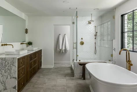 a bathroom with a bathtub and shower