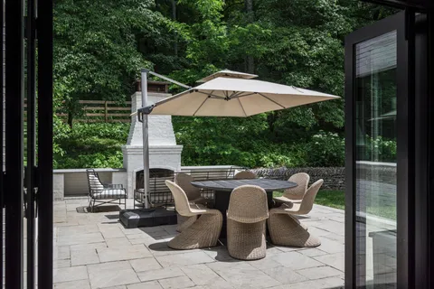 swimming pool view with a seating space