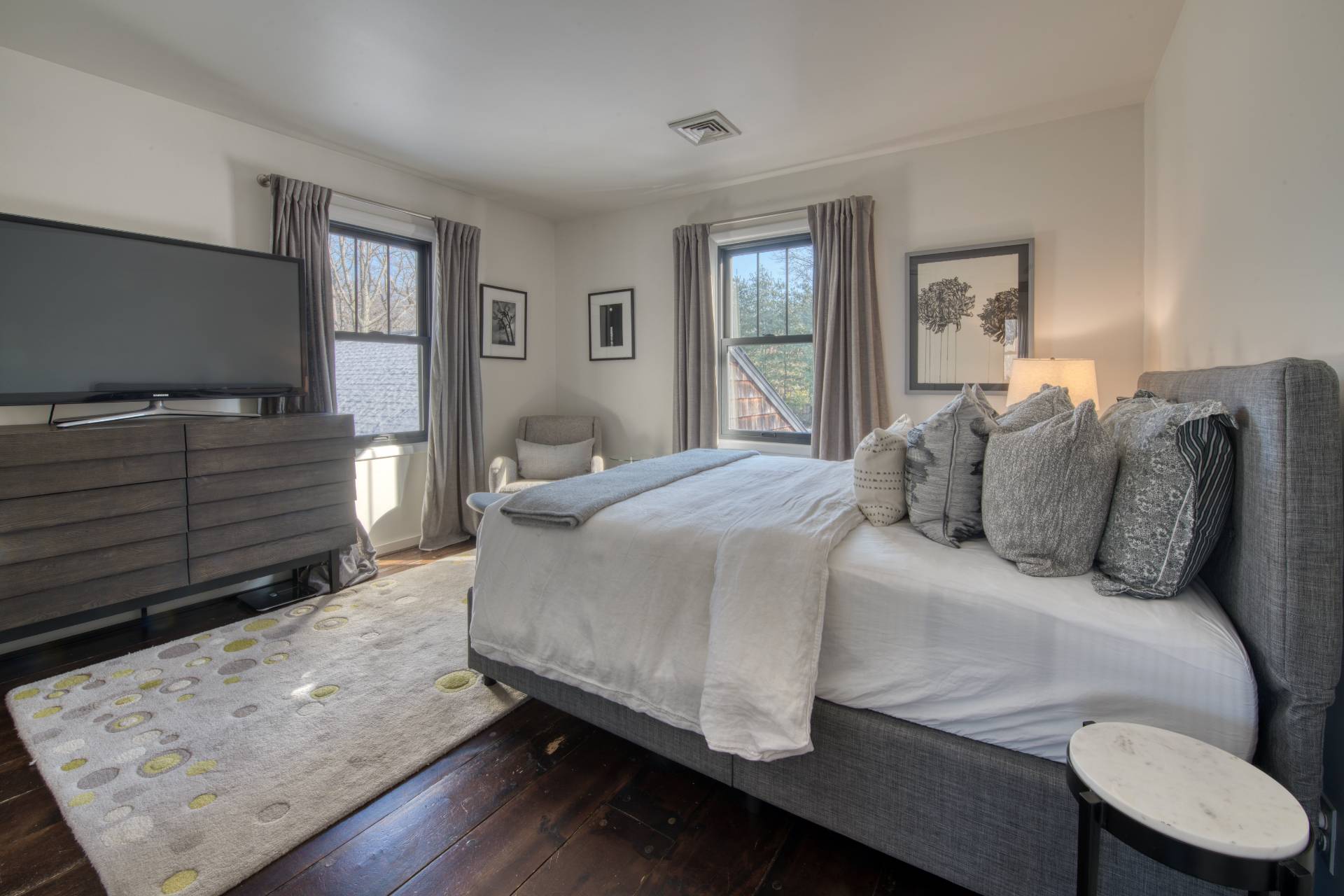 Undisclosed Address Sag Harbor, NY 11963 - Photo 12 of 23 a living room with a bed furniture and a flat screen tv