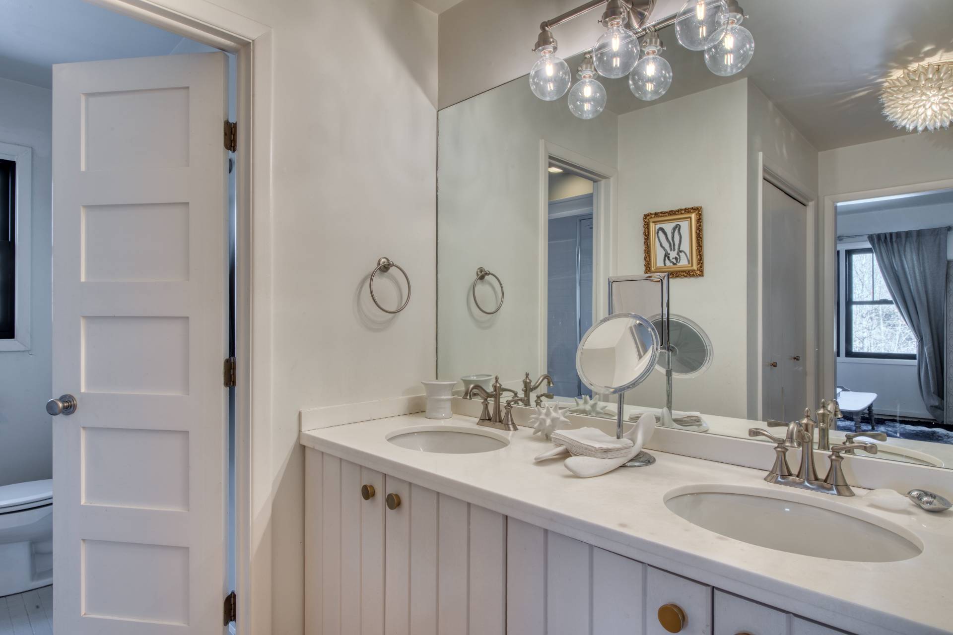 Undisclosed Address Sag Harbor, NY 11963 - Photo 17 of 23 a bathroom with a double vanity sink and a mirror