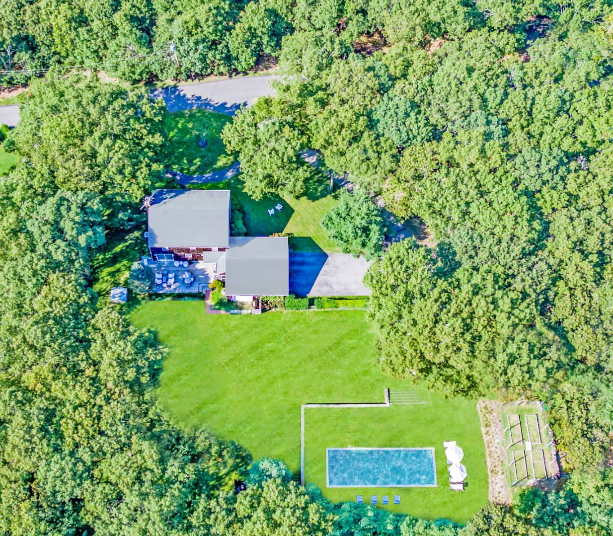 Undisclosed Address Sag Harbor, NY 11963 - Photo 2 of 23 a view of a house with a yard and a large tree