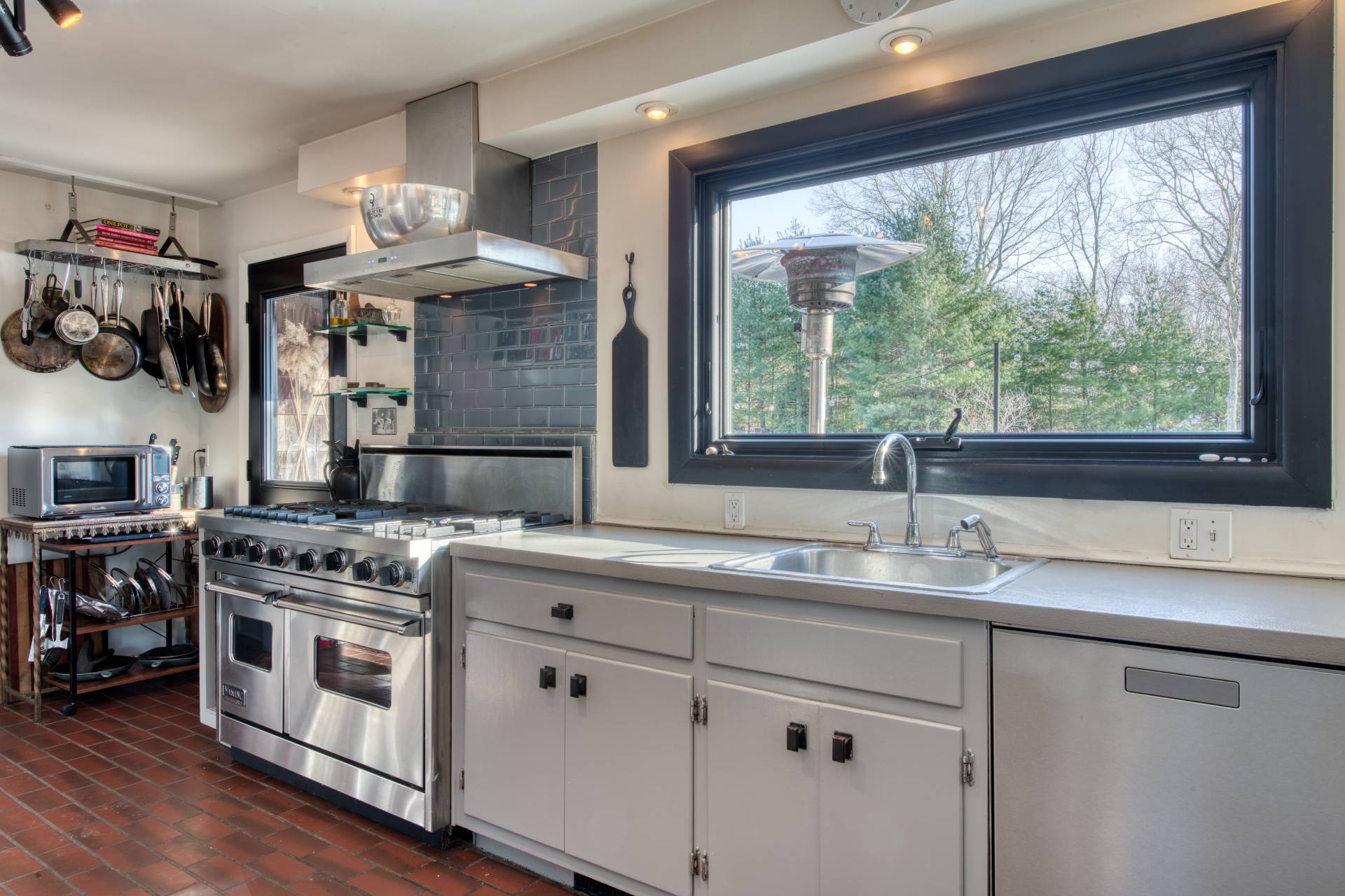 Undisclosed Address Sag Harbor, NY 11963 - Photo 9 of 23 a kitchen with stainless steel appliances granite countertop a sink a stove and a wooden floors