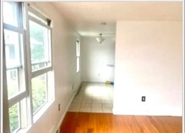 a view of a hallway with a large window