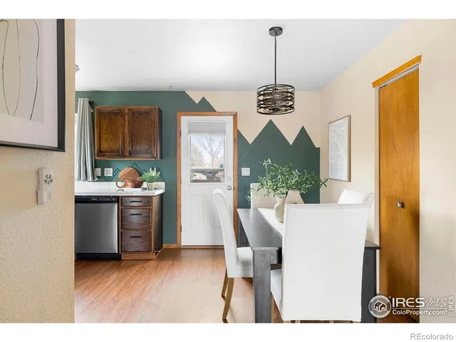 a kitchen with a table and chairs
