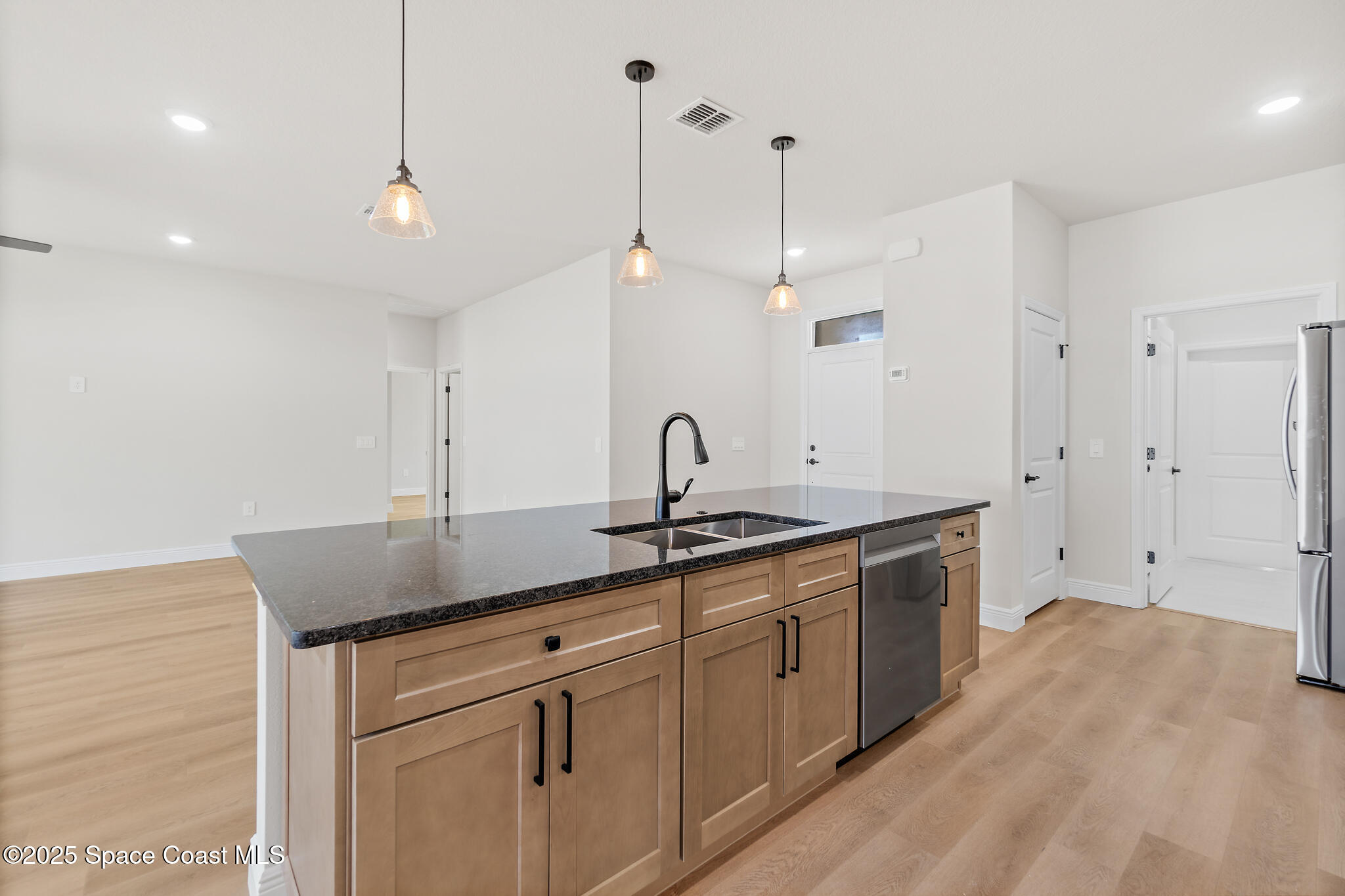 1541 Madison Road Northwest Palm Bay, FL 32907 - Photo 11 of 62 a kitchen with a sink and cabinets