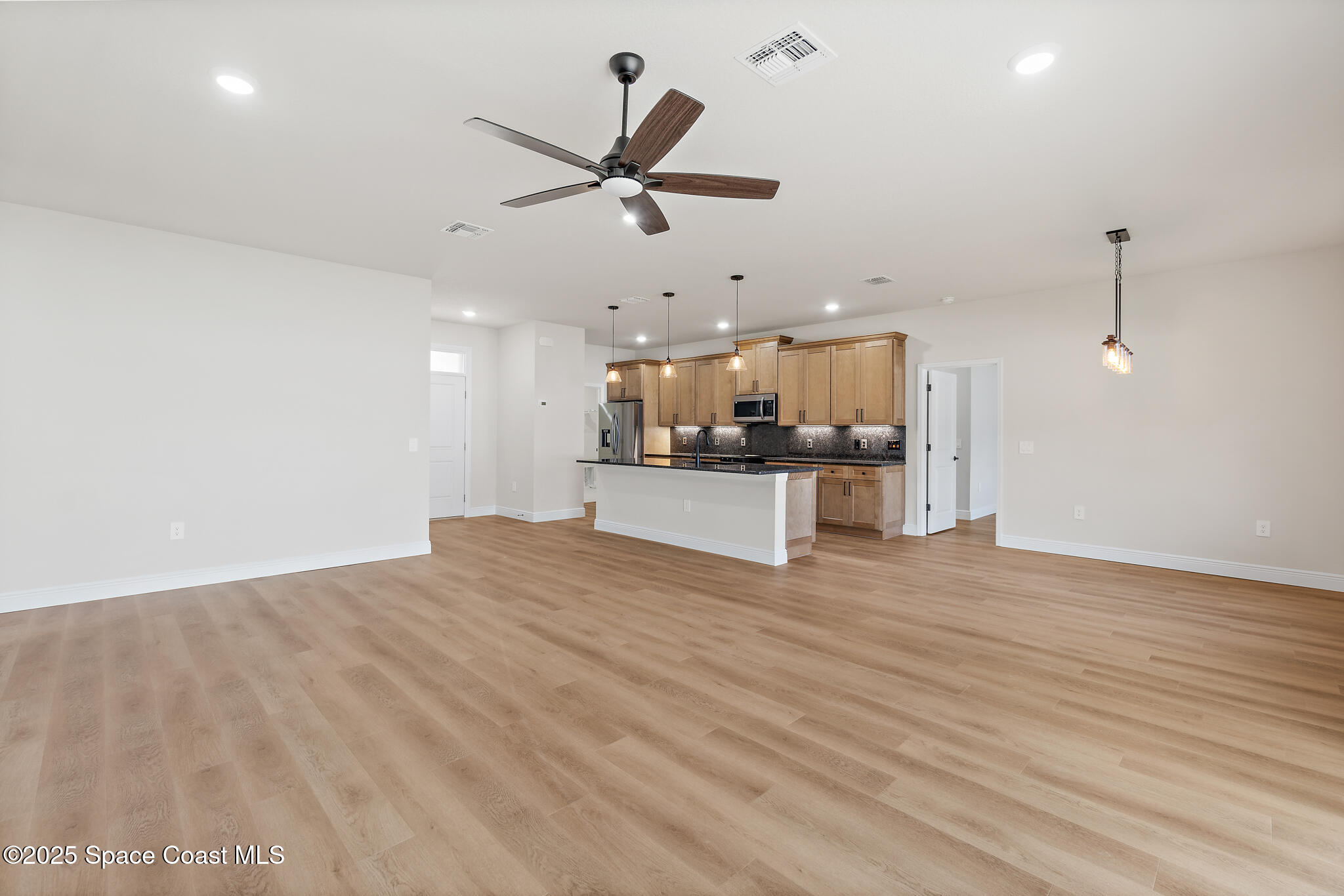 1541 Madison Road Northwest Palm Bay, FL 32907 - Photo 21 of 62 a view of a kitchen with a sink and a stove