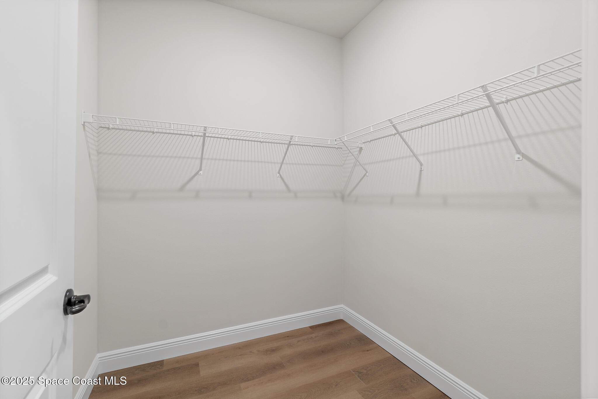 1541 Madison Road Northwest Palm Bay, FL 32907 - Photo 26 of 62 a view of a room with racks on the wall