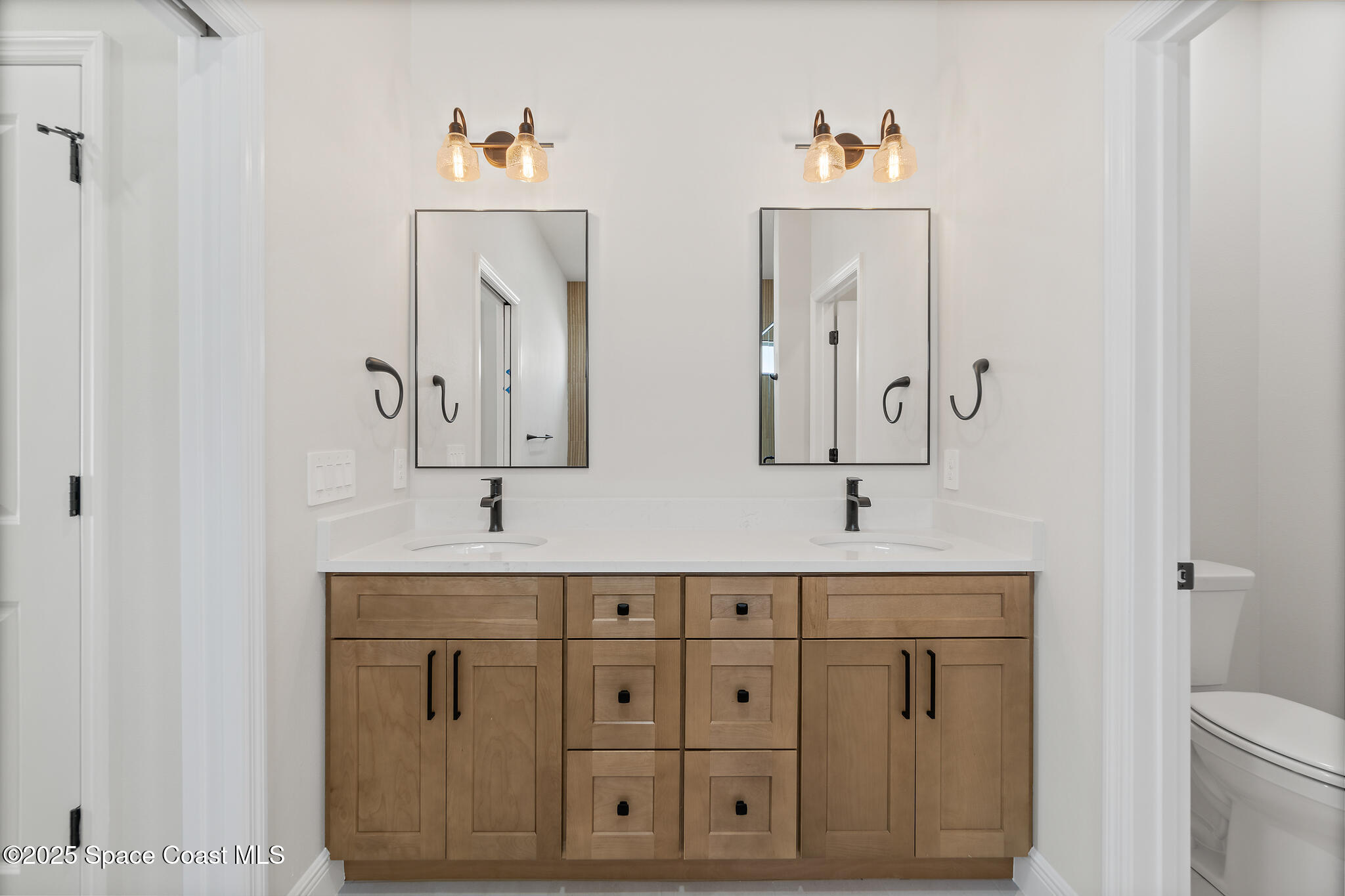 1541 Madison Road Northwest Palm Bay, FL 32907 - Photo 27 of 62 a bathroom with a sink and a mirror