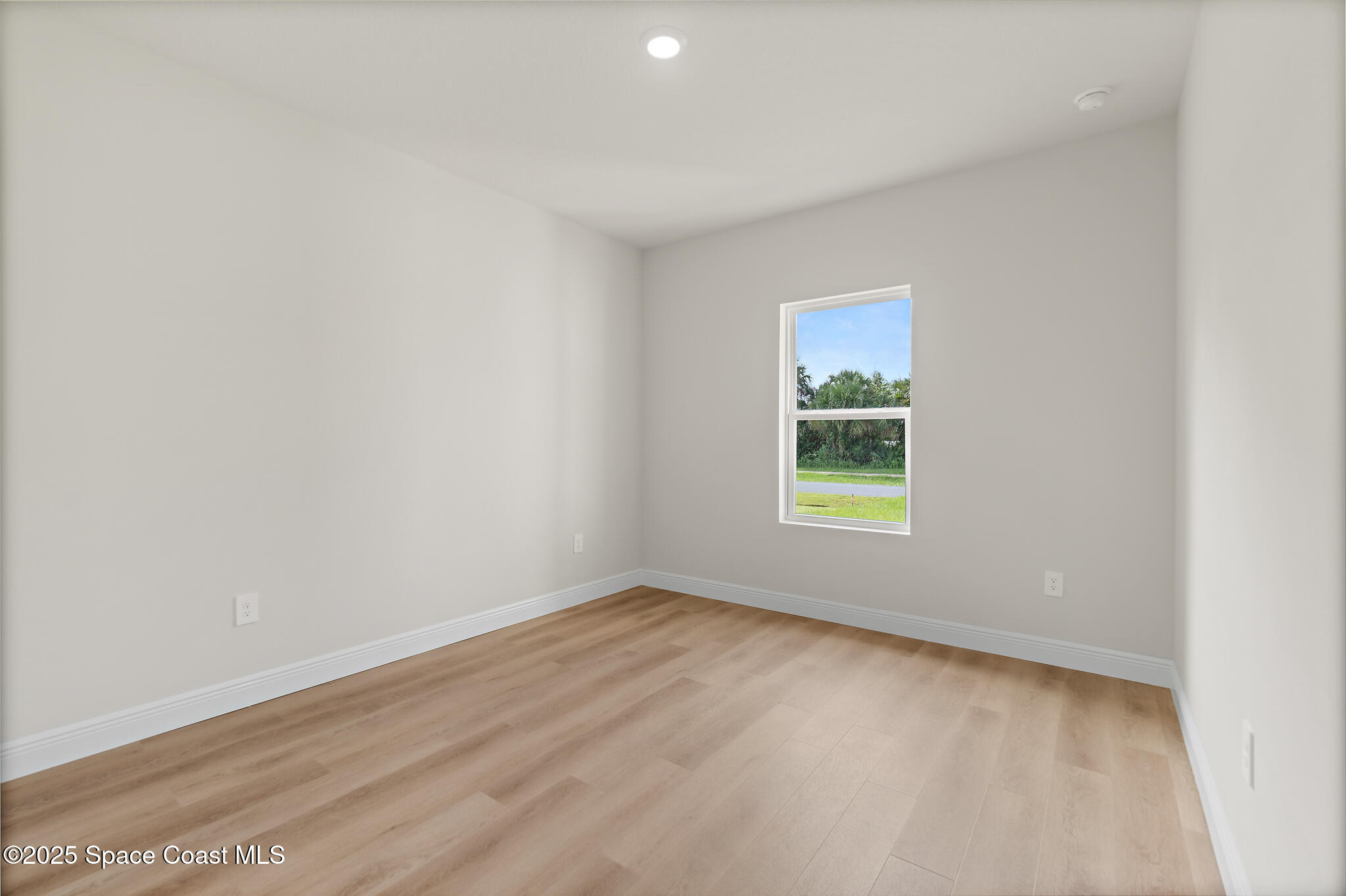 1541 Madison Road Northwest Palm Bay, FL 32907 - Photo 34 of 62 an empty room with a window