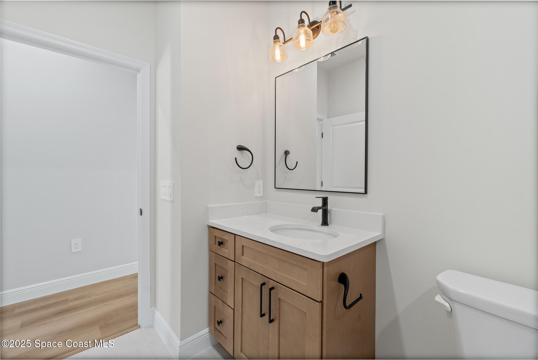 1541 Madison Road Northwest Palm Bay, FL 32907 - Photo 37 of 62 a bathroom with a sink and a toilet