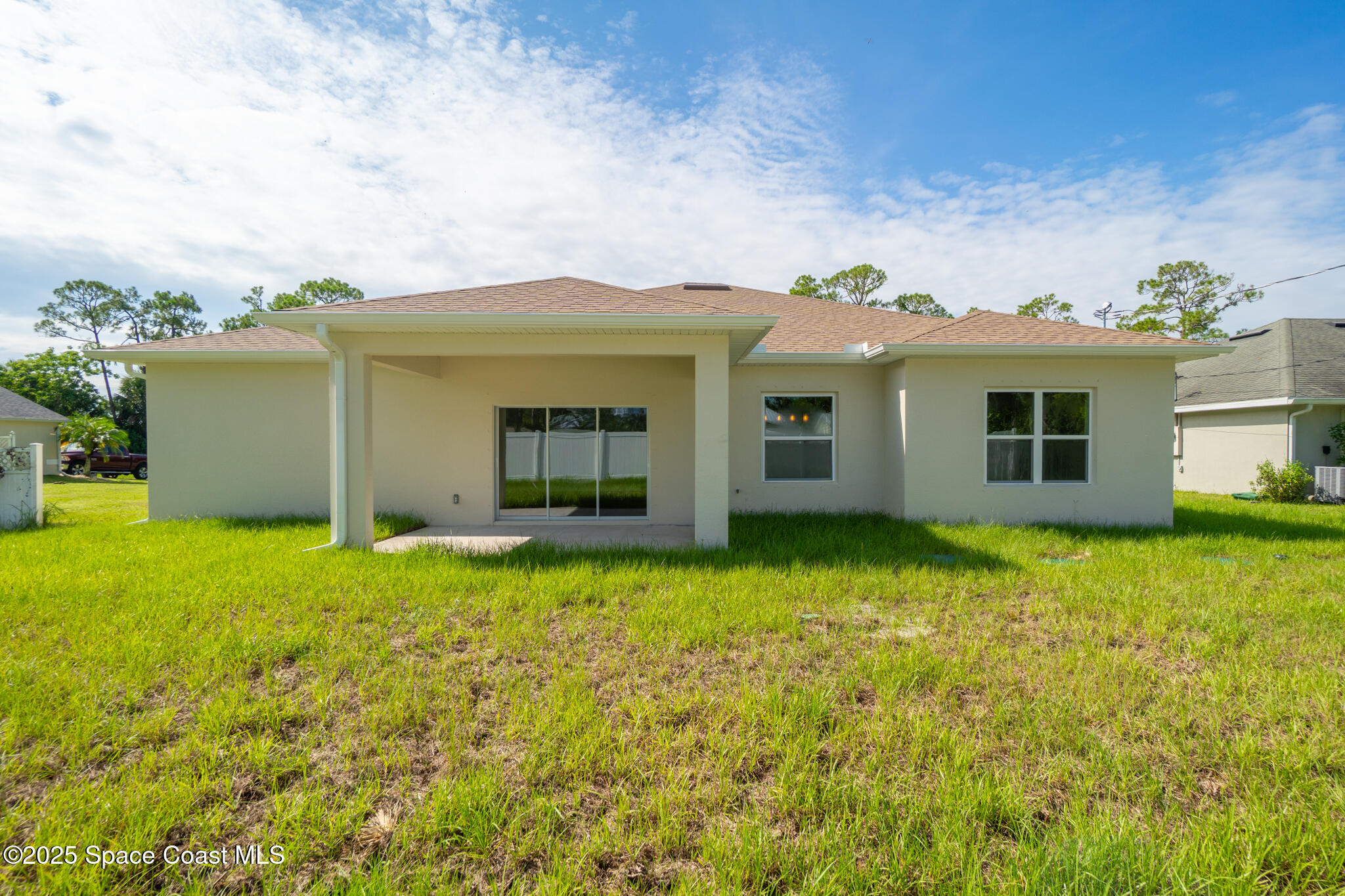 1541 Madison Road Northwest Palm Bay, FL 32907 - Photo 53 of 62 a view of a house with backyard and garden