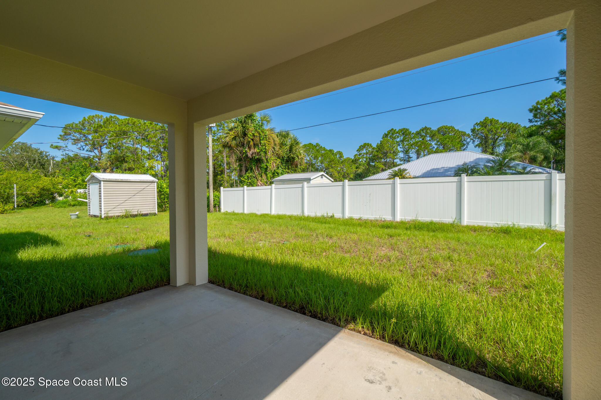 1541 Madison Road Northwest Palm Bay, FL 32907 - Photo 55 of 62 a view of a back yard