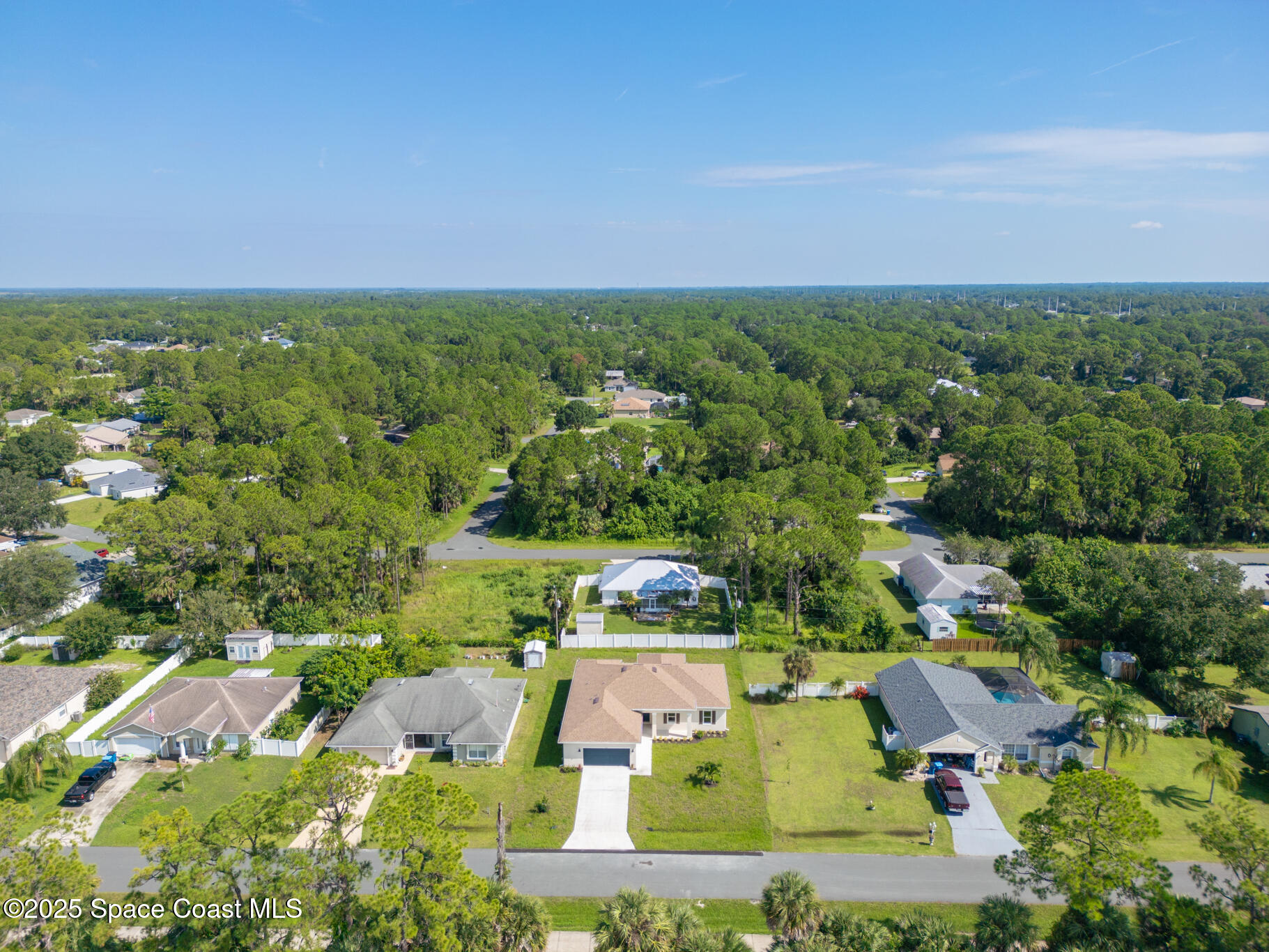 1541 Madison Road Northwest Palm Bay, FL 32907 - Photo 59 of 62 an aerial view of house with yard swimming pool and outdoor seating