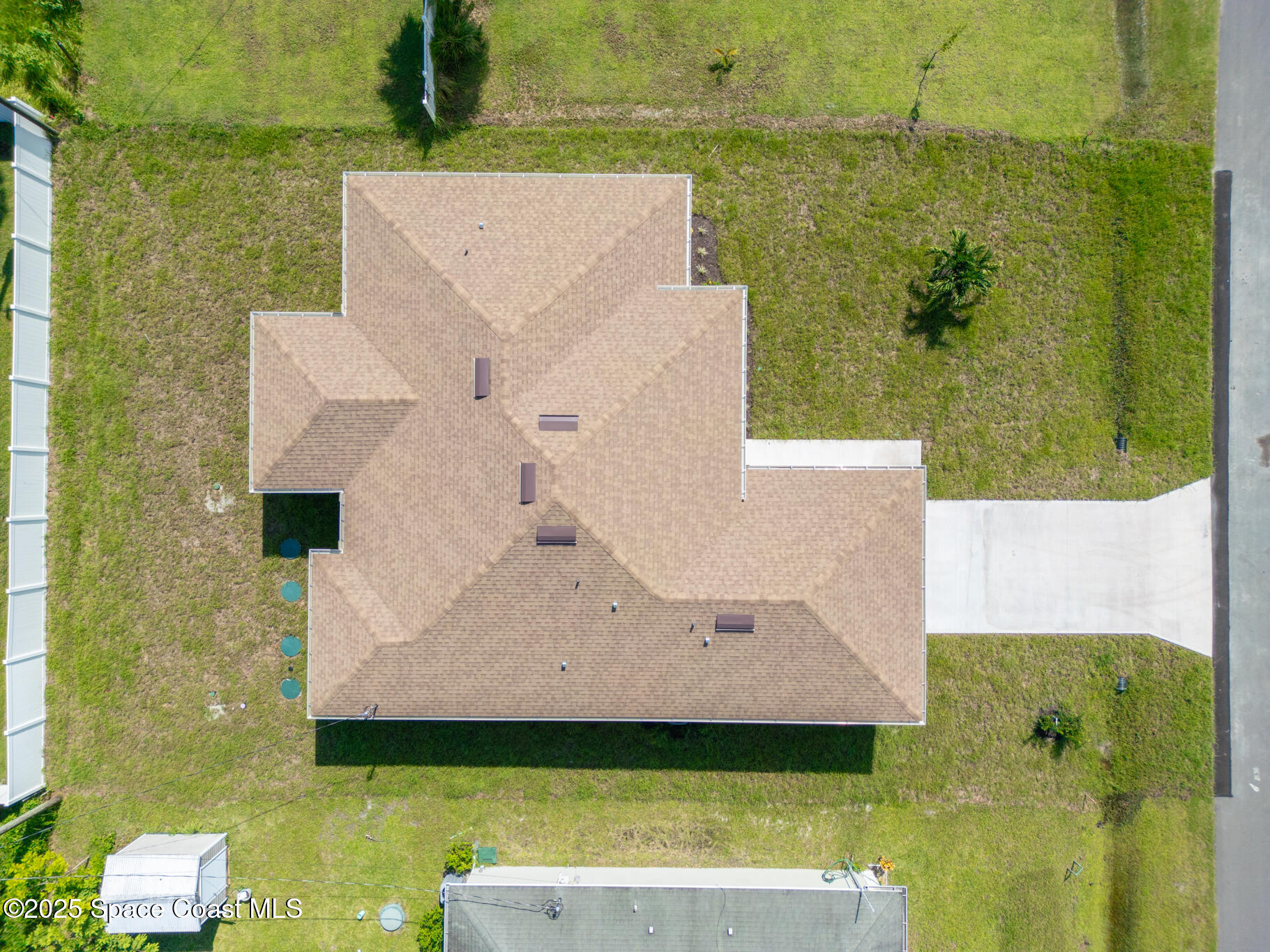1541 Madison Road Northwest Palm Bay, FL 32907 - Photo 6 of 62 an aerial view of a house with a garden