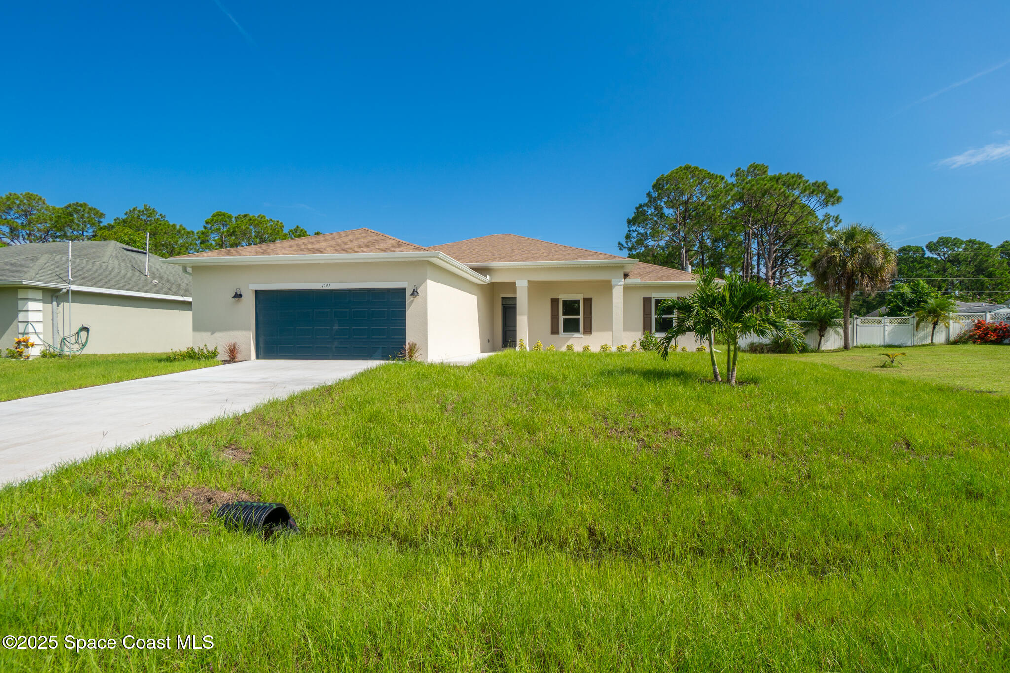 1541 Madison Road Northwest Palm Bay, FL 32907 - Photo 7 of 62 a view of house with backyard