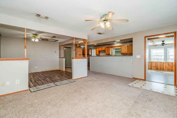 a view of a kitchen with a sink and cabinets