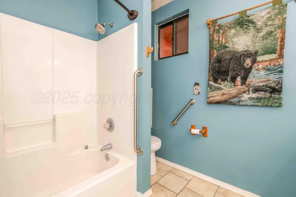 a spacious bathroom with a double vanity sink and a mirror