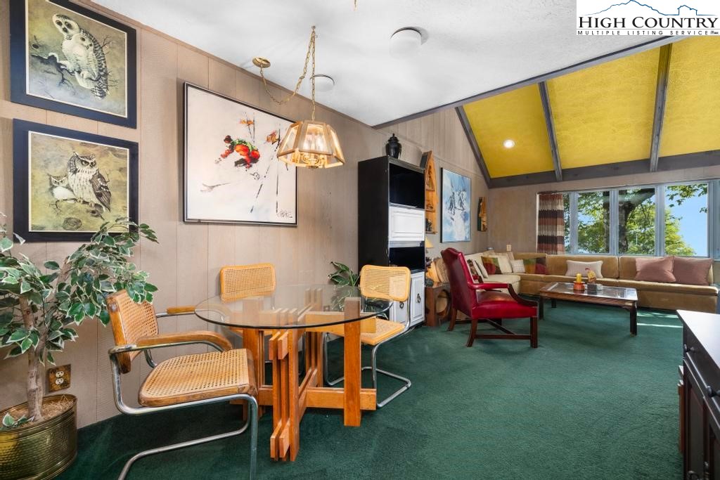 220 Northridge Road, Unit D15 Beech Mountain, NC 28604 - Photo 12 of 47 a living room with furniture and a large window