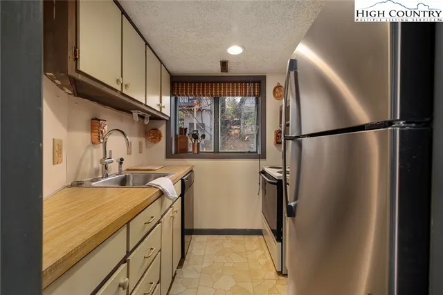 a living room with furniture fireplace and flat screen tv
