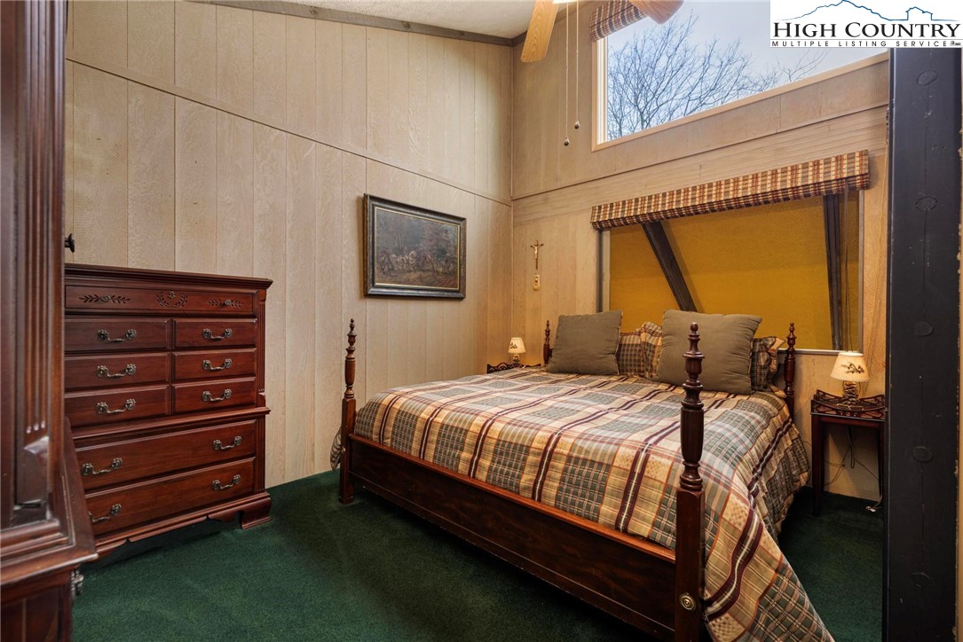 220 Northridge Road, Unit D15 Beech Mountain, NC 28604 - Photo 21 of 47 a bedroom with a bed next to a window