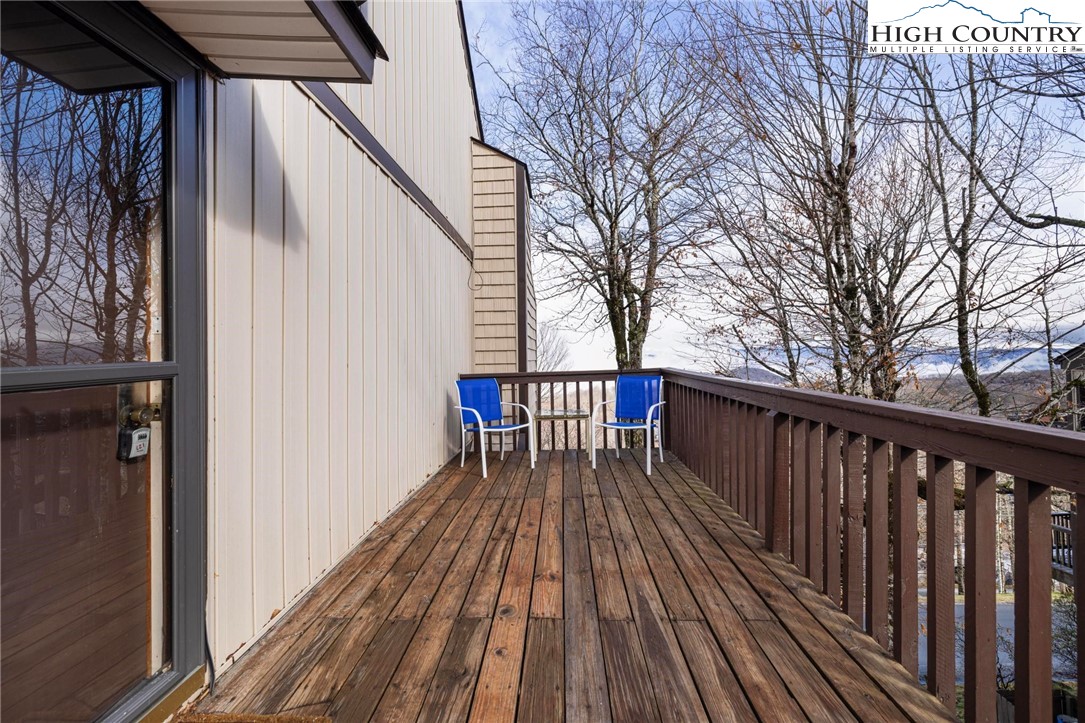 220 Northridge Road, Unit D15 Beech Mountain, NC 28604 - Photo 29 of 47 a balcony with wooden floor and trees