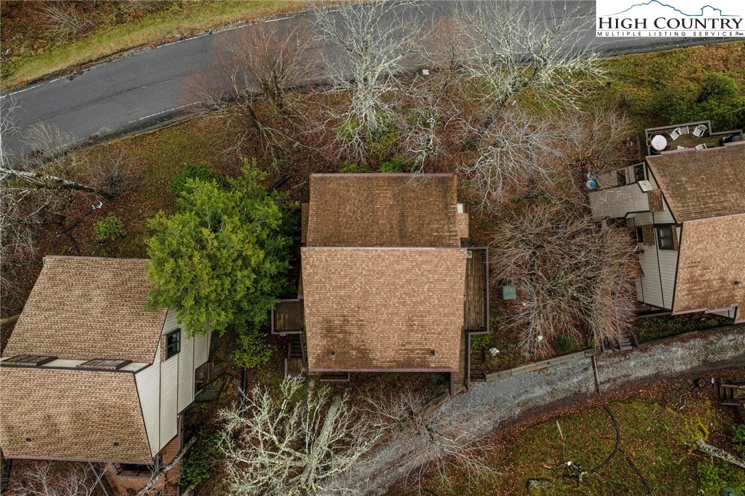 220 Northridge Road, Unit D15 Beech Mountain, NC 28604 - Photo 32 of 47 an aerial view of a house with yard