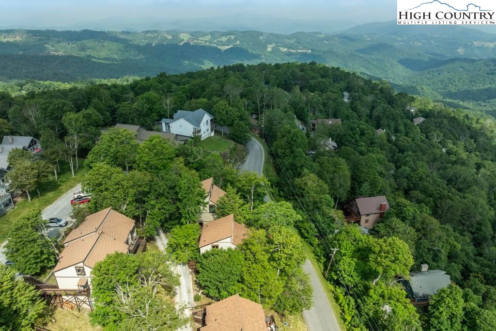 220 Northridge Road, Unit D15 Beech Mountain, NC 28604 - Photo 35 of 47 an aerial view of a house with a yard