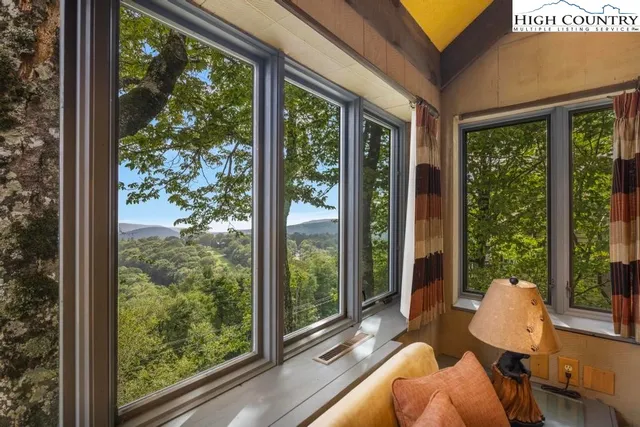 a en suite bathroom with a granite countertop sink and a mirror