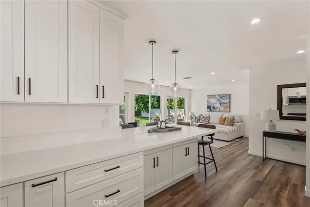 a bedroom with a large bed and a walk in closet