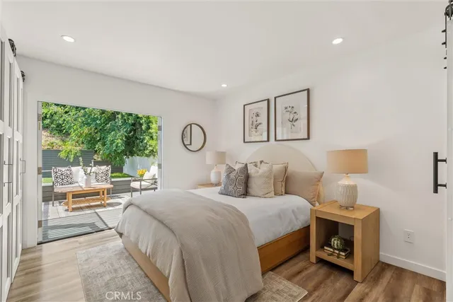 a white bath tub sitting next to a white sink