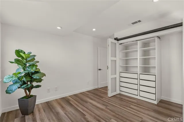 a outdoor space with lots of furniture and wooden floor