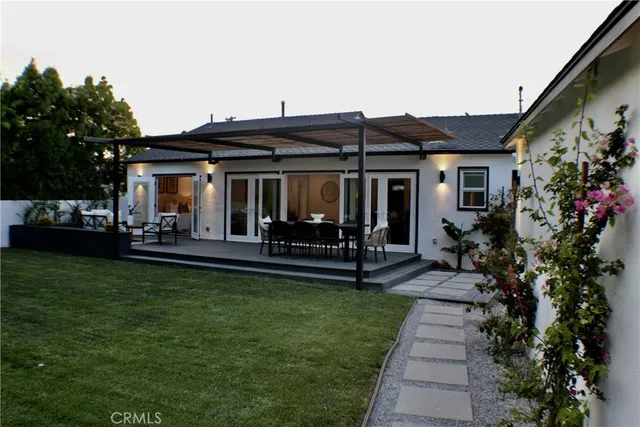 a view of a garden with chairs