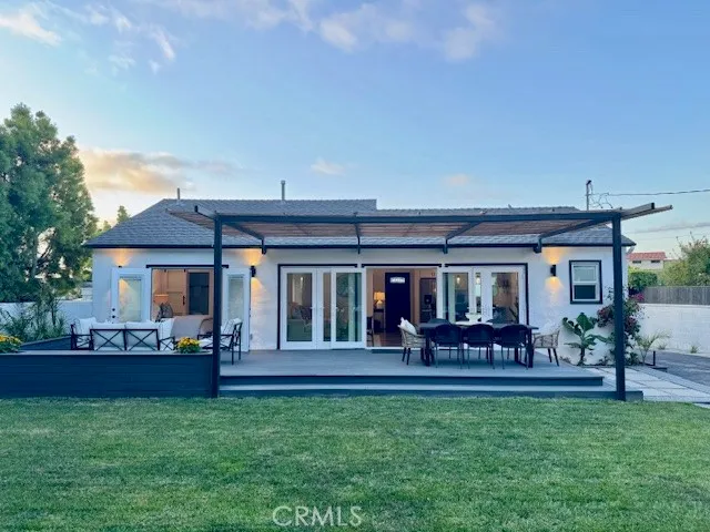 a view of house with backyard