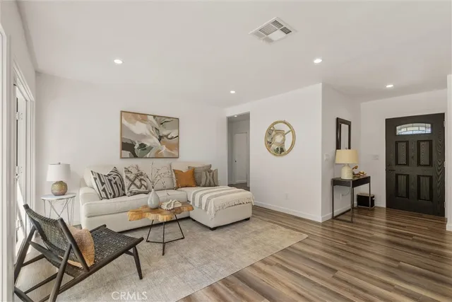 a kitchen with a dining table cabinets and stainless steel appliances