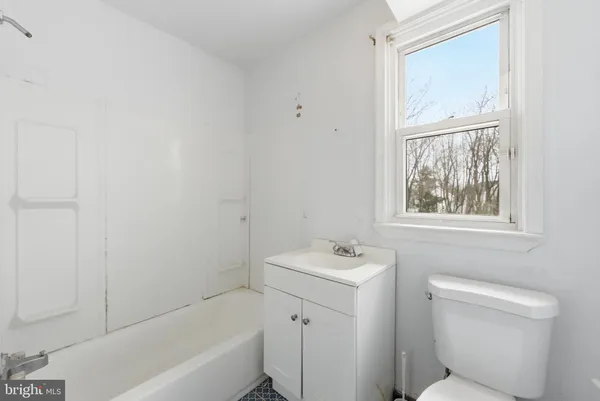 a bathroom with a sink toilet and bathtub