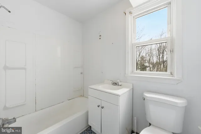 a bathroom with a sink toilet and bathtub