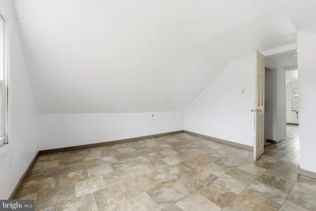 an empty room with a bench