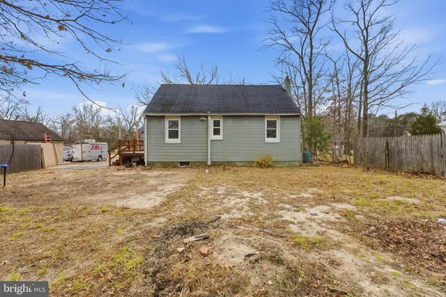 a house with trees in the background