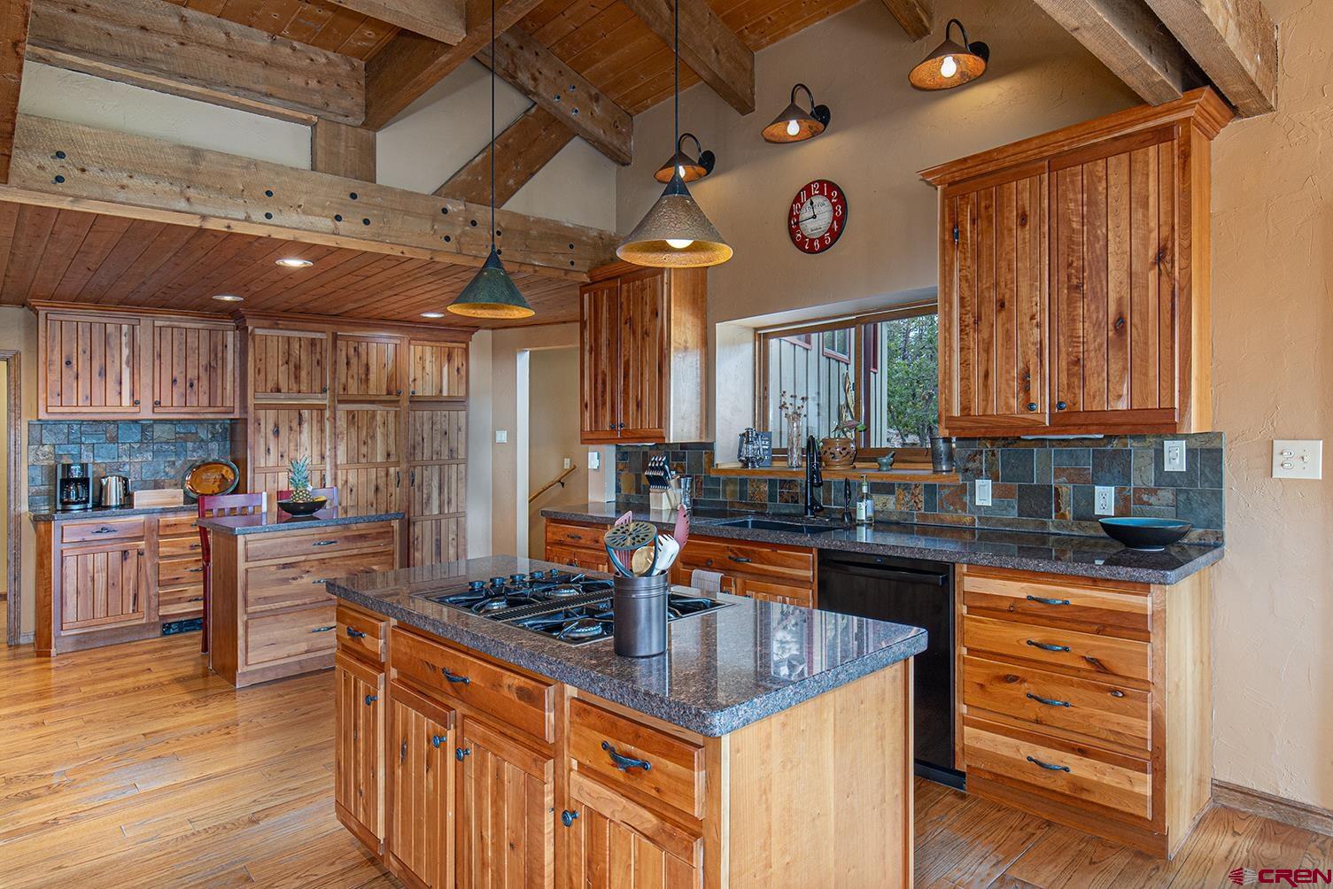 375 Nusbaum Road Durango, CO 81301 - Photo 11 of 33 a kitchen with stainless steel appliances granite countertop a sink stove and cabinets